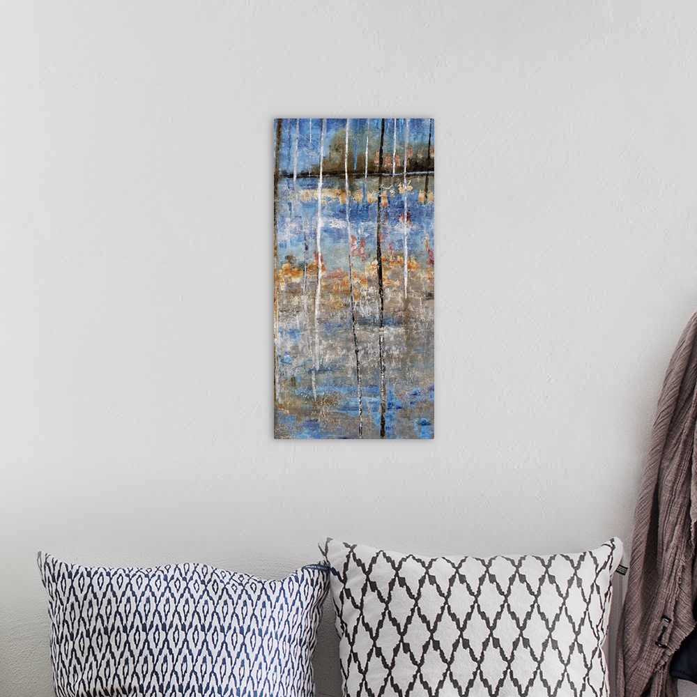 A bohemian room featuring Tall abstract painting with blue, gray, and orange hues resembling a lake and trees on the shore ...