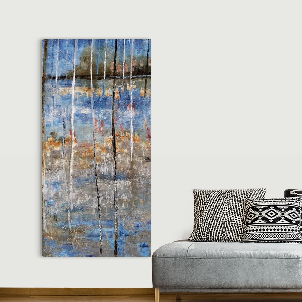 A bohemian room featuring Tall abstract painting with blue, gray, and orange hues resembling a lake and trees on the shore ...