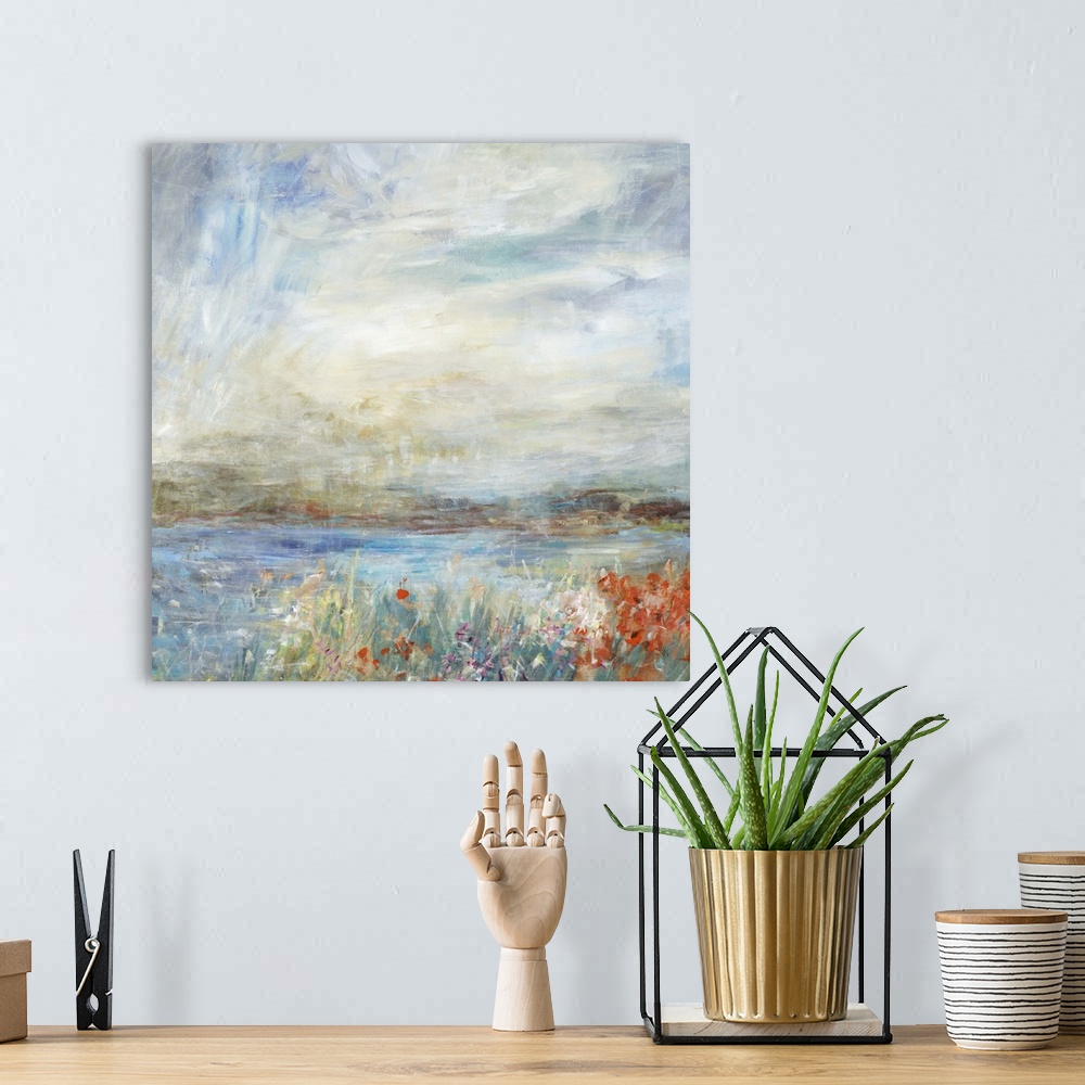 A bohemian room featuring Contemporary landscape painting looking out onto a lake in the countryside.