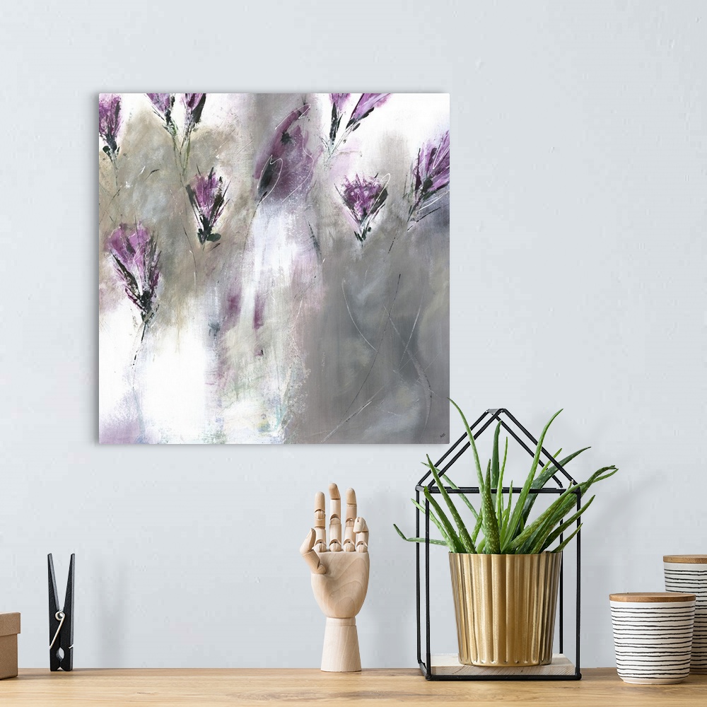 A bohemian room featuring Square painting of abstract lavender colored lilies on a gray and white background.