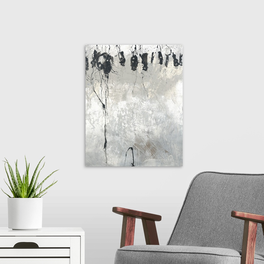 A modern room featuring Large black, gray, and white abstract painting with faint pale yellow hues at the top underneath ...
