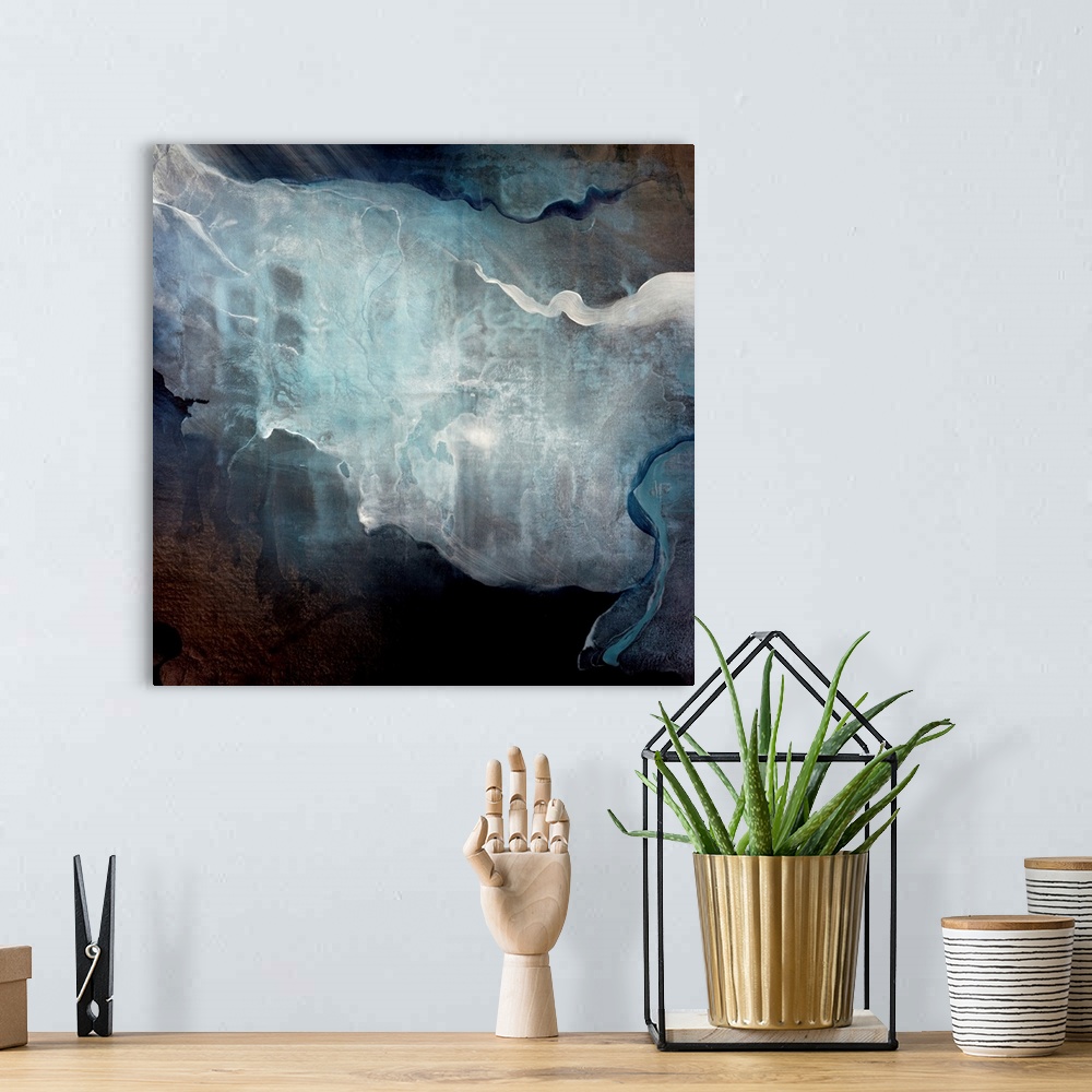 A bohemian room featuring Abstract art of bright colors resembling smoke wafting on a dark background.