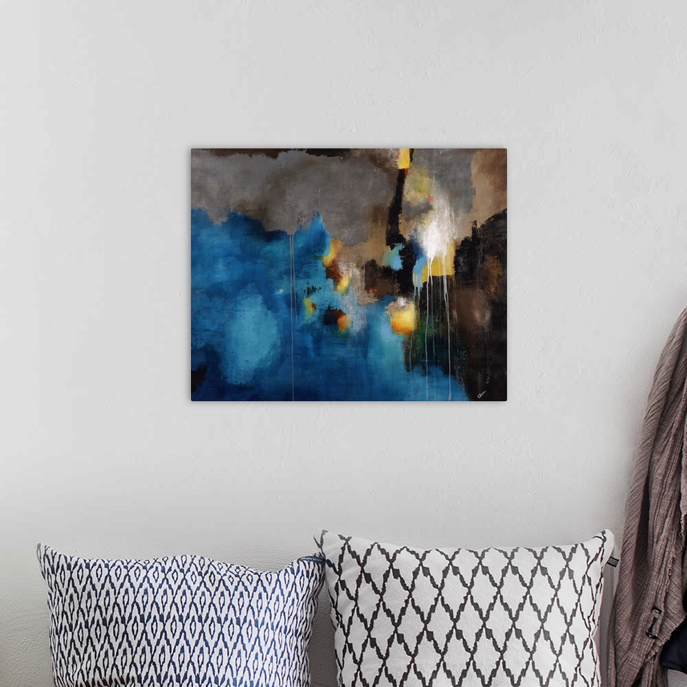 A bohemian room featuring Abstract painting using bright blue toward the bottom of the image with light earthy tones toward...