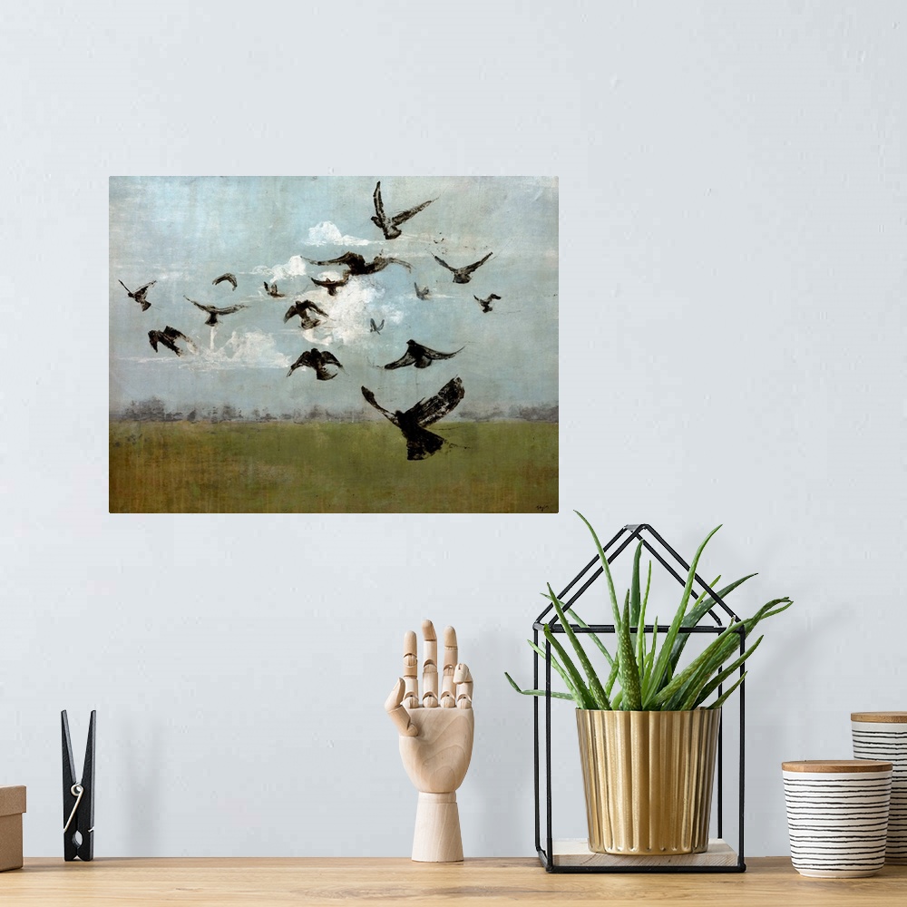 A bohemian room featuring Contemporary painting of bird silhouettes flying in cloudy sky.