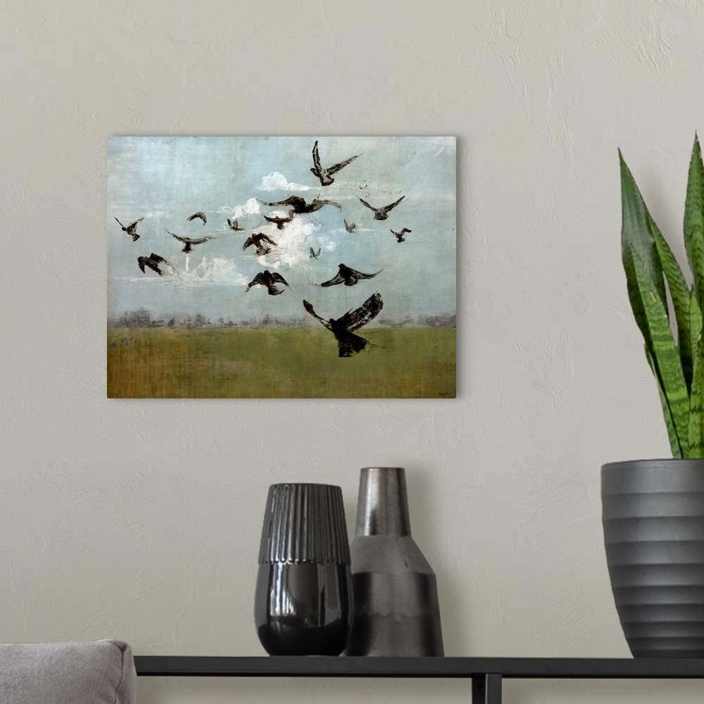 A modern room featuring Contemporary painting of bird silhouettes flying in cloudy sky.