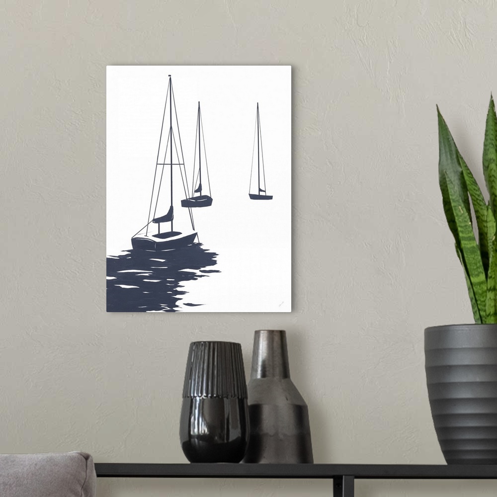 A modern room featuring A modest design in white and dark blue of a few sailboats floating in the water.