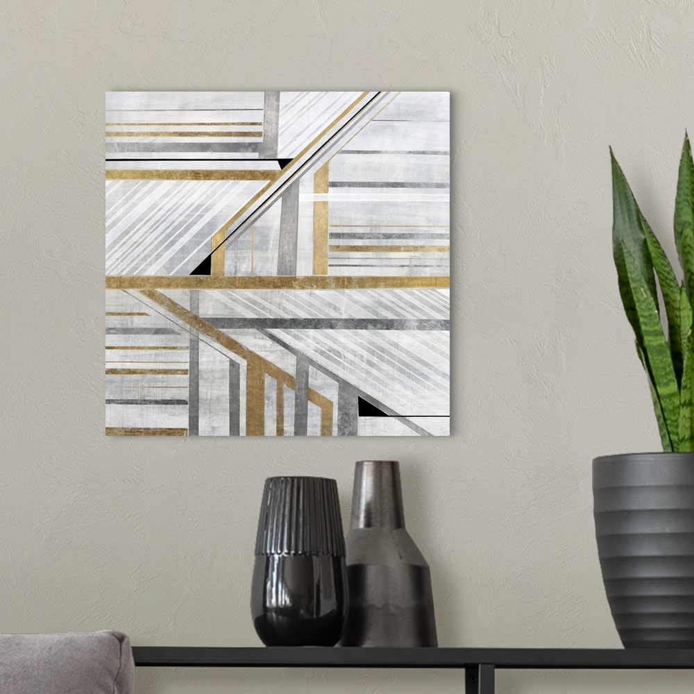 A modern room featuring Geometric abstract art with silver, white, and gold lines and angles coming together to create mo...