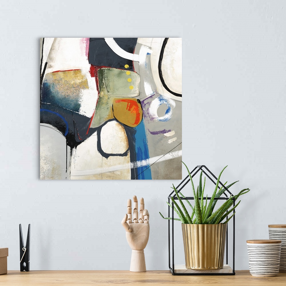 A bohemian room featuring Square abstract art created with shapes in various colors coming together in the center with a gr...
