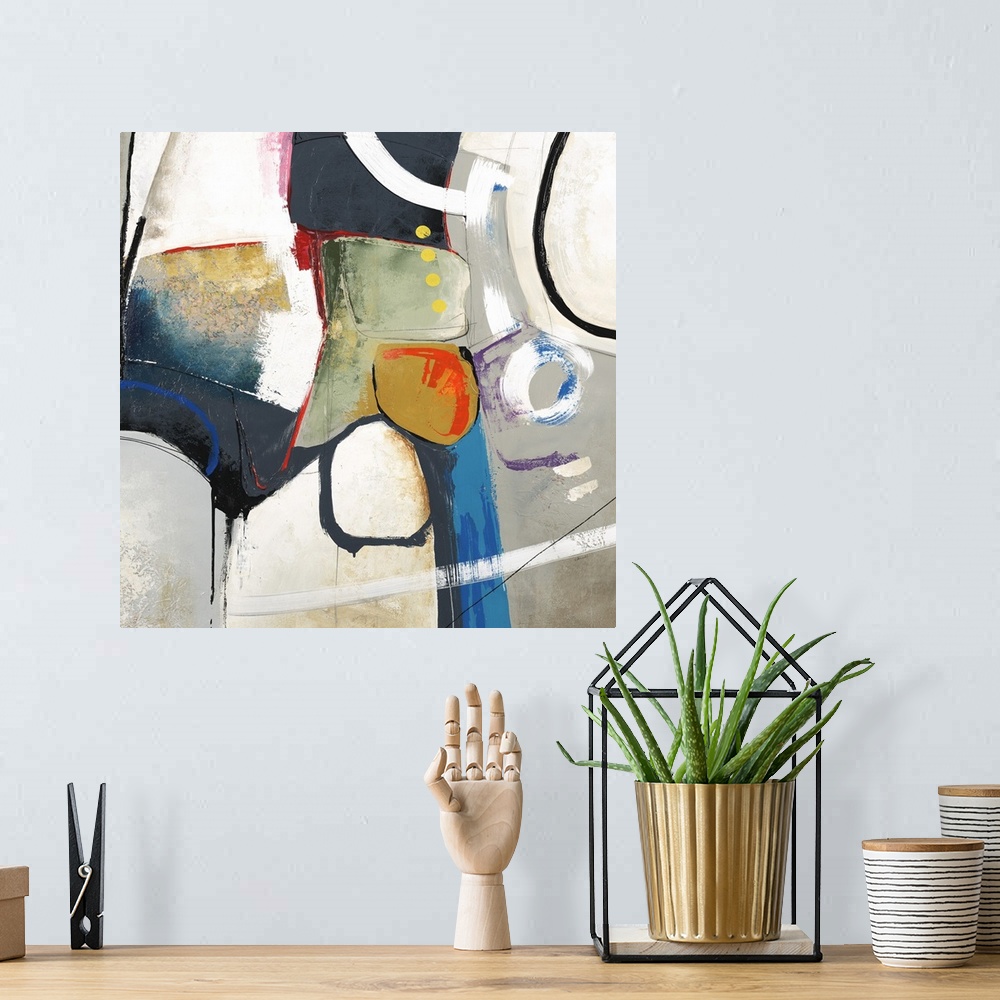 A bohemian room featuring Square abstract art created with shapes in various colors coming together in the center with a gr...