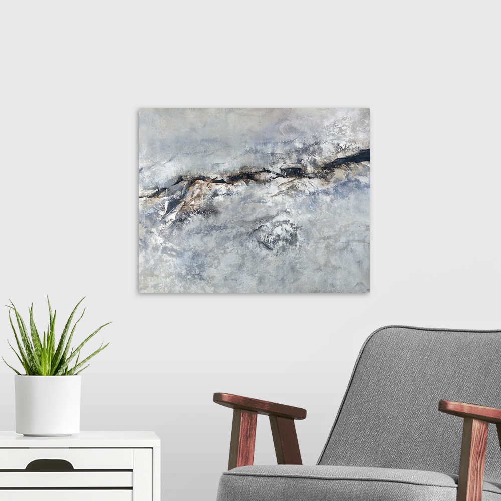 A modern room featuring Contemporary abstract painting with shades of gray, silver, blue, and brown creating texture.