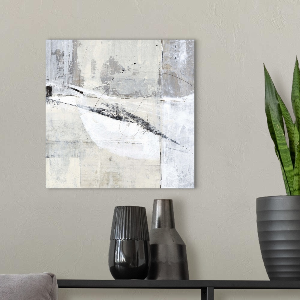 A modern room featuring Square contemporary abstract painting with sections of gray, white, and tan hues with thin, black...