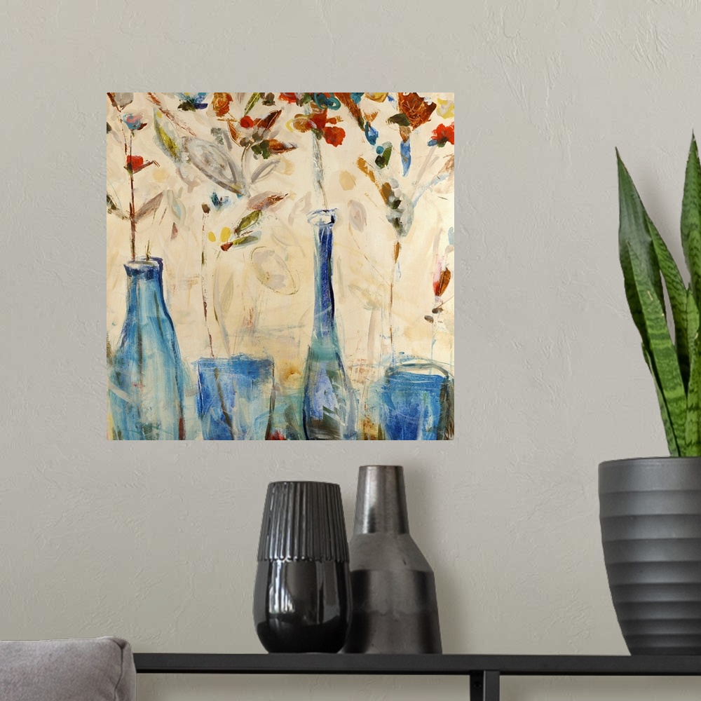 A modern room featuring Blue vases line the bottom of the artwork as tall colorful flowers sprout from them.