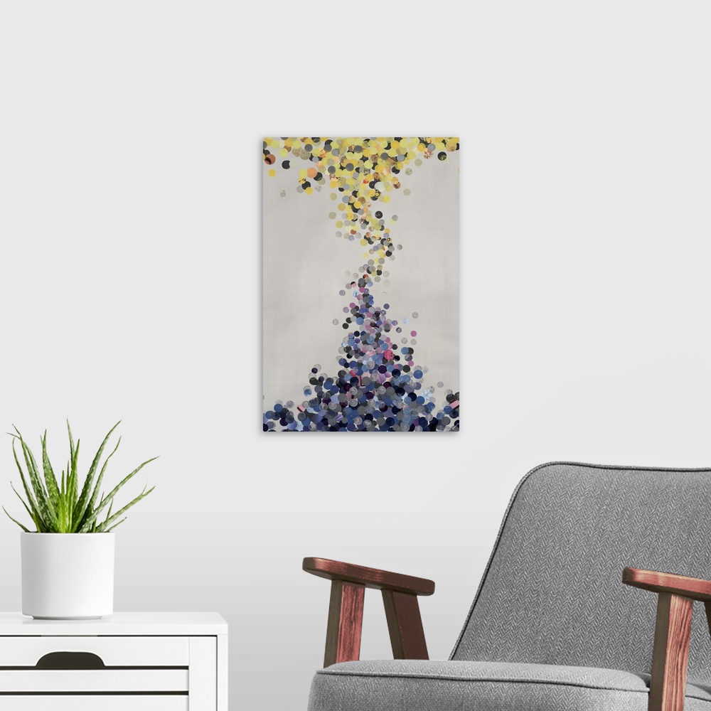 A modern room featuring Abstract painting of warm toned circles merging with cool toned circles.