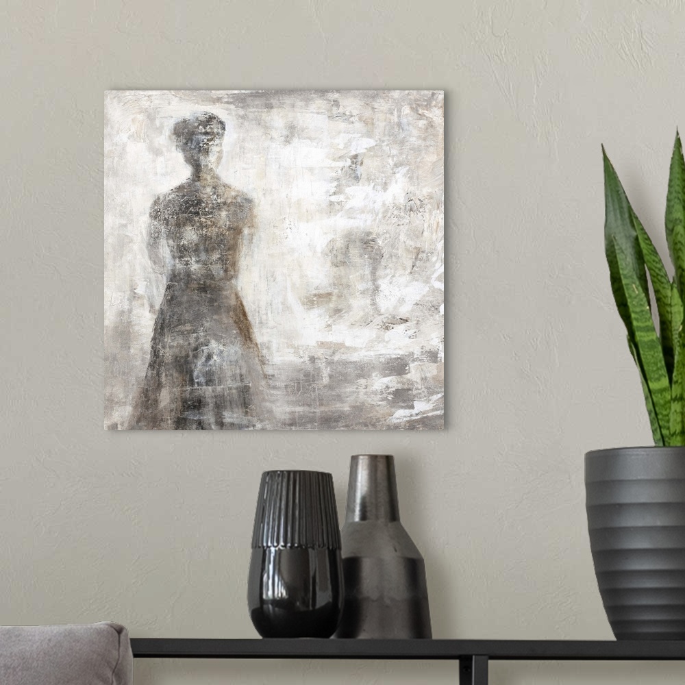 A modern room featuring Contemporary abstract painting using dark neutral tones and a smokey form.