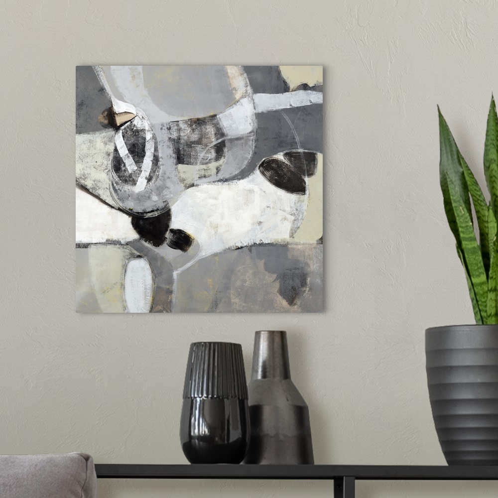 A modern room featuring Square abstract painting with gray, white, and beige rounded out sections and black accents.