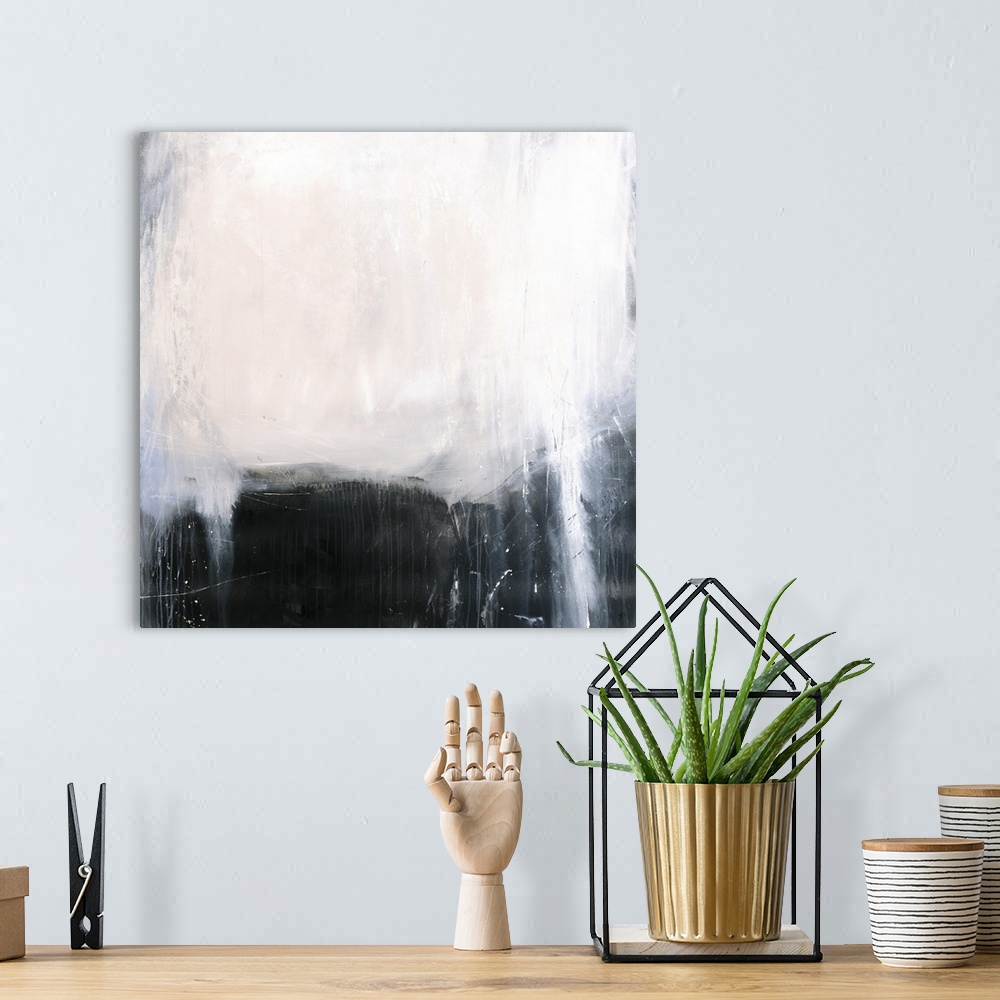 A bohemian room featuring Square abstract painting with a dark black and gray background and a big white spot at the top wi...