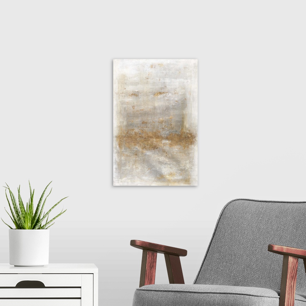 A modern room featuring Large abstract artwork with a gray and white background and metallic gold on top.