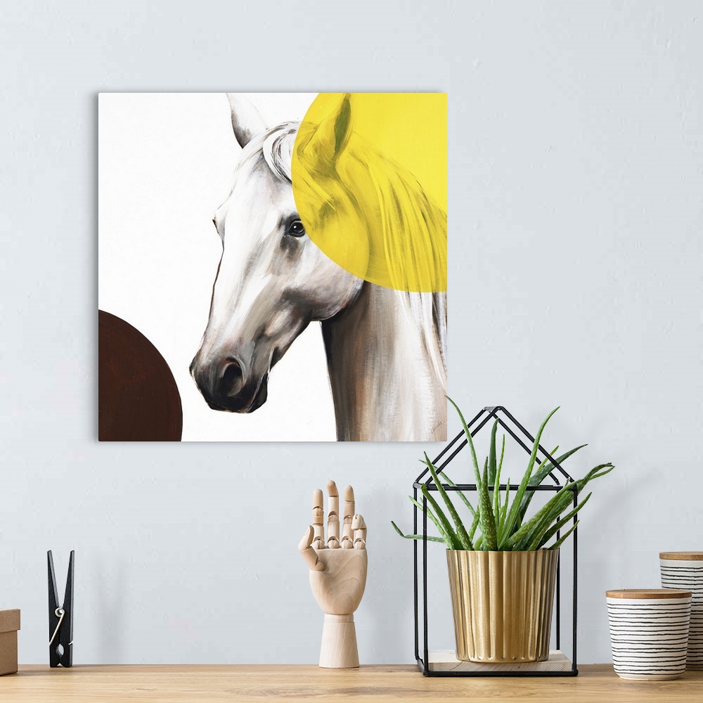 A bohemian room featuring Square artwork with a white and brown toned horse and two large circles in the corners, one yello...
