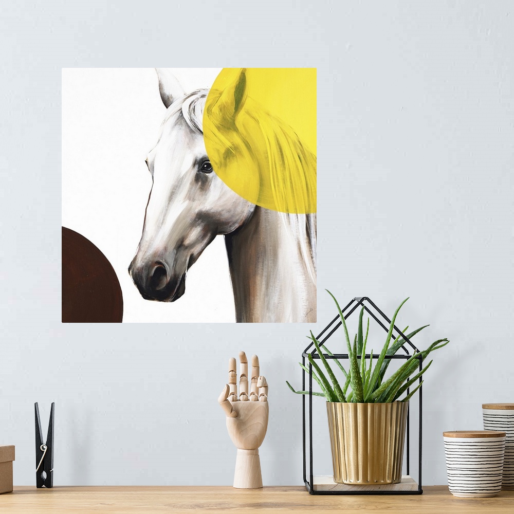 A bohemian room featuring Square artwork with a white and brown toned horse and two large circles in the corners, one yello...