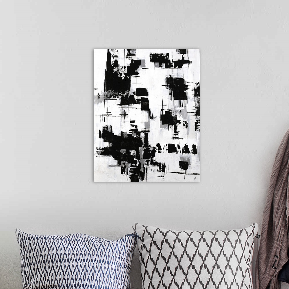 A bohemian room featuring Black and white abstract painting with grey shadows.