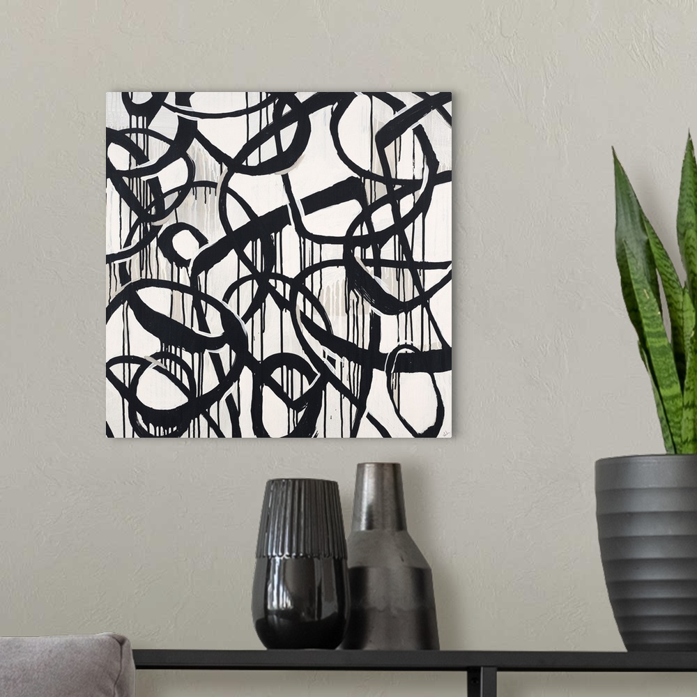 A modern room featuring Contemporary high contrast abstract painting using deep black organic lines in a circular motion.