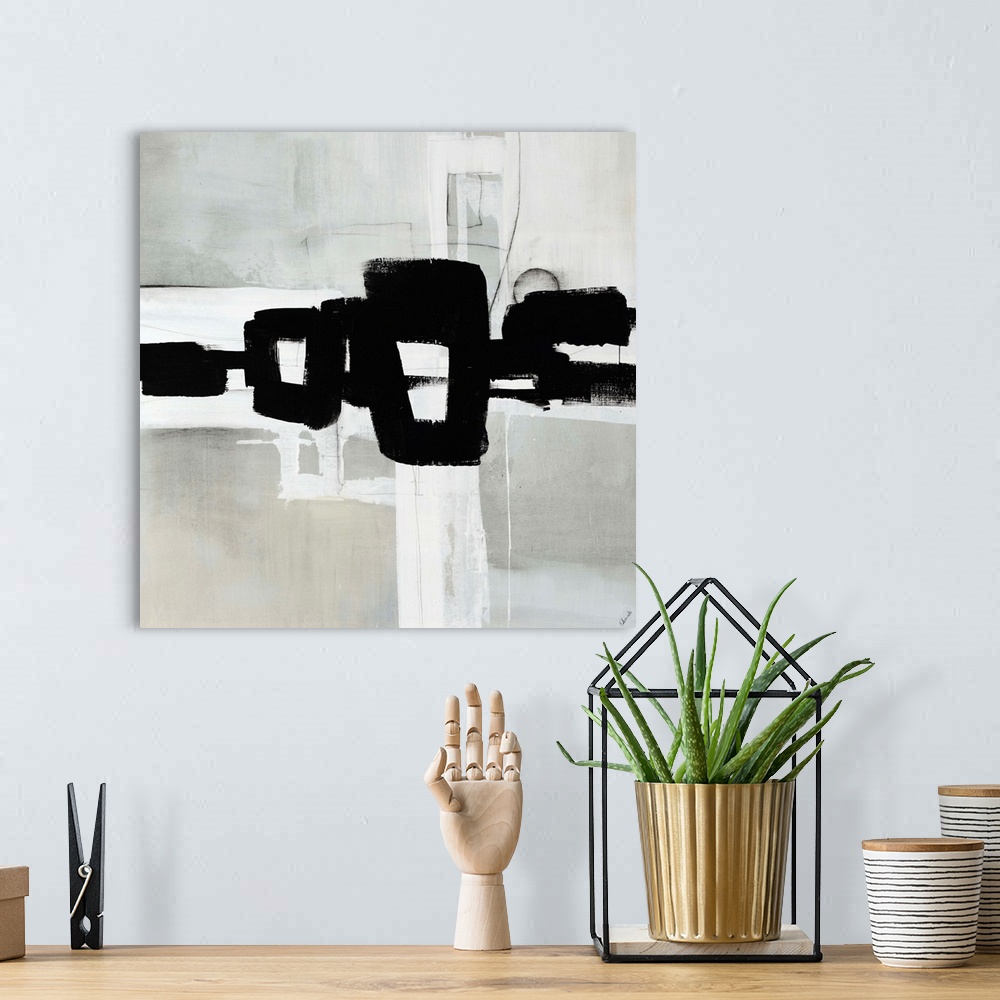 A bohemian room featuring An abstract black-and-white painting with a soft gray-washed background and a bold geometric brus...