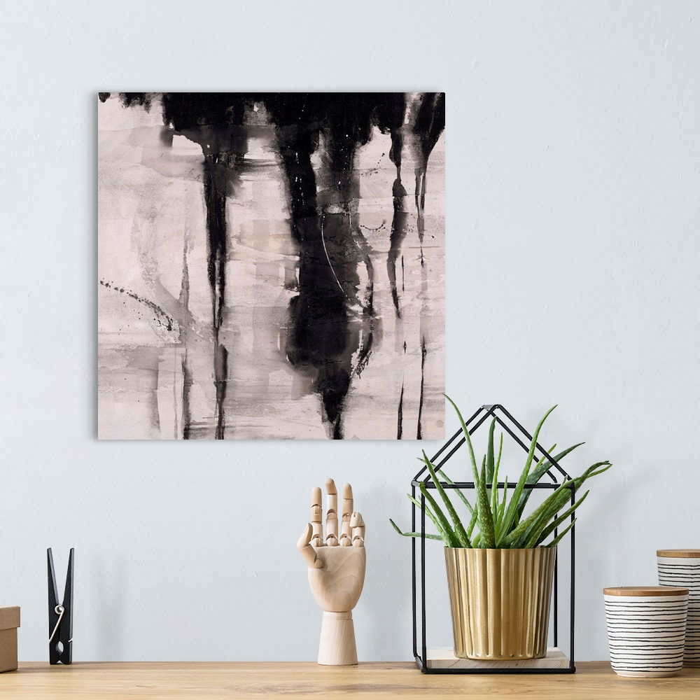 A bohemian room featuring Abstract painting using black paint dripping down from top of image, against a gray toned backgro...