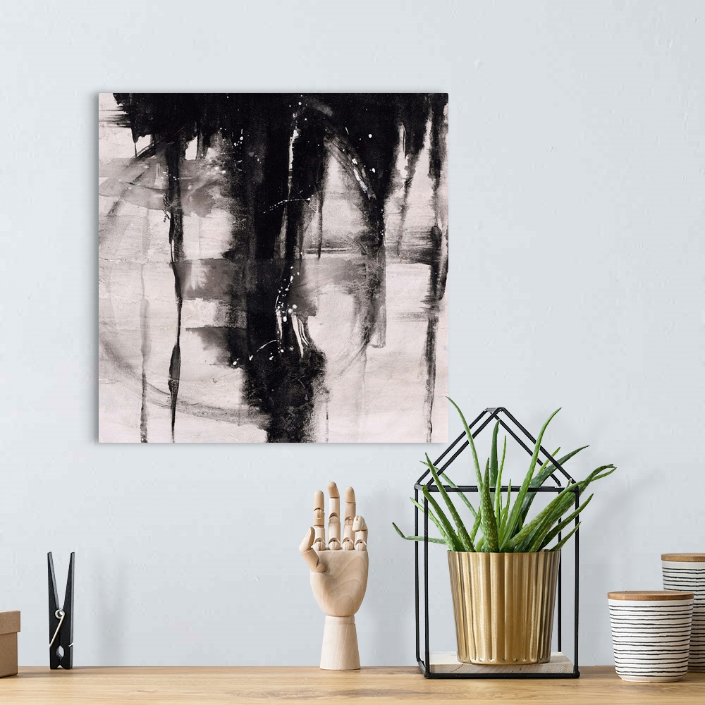 A bohemian room featuring Abstract painting using black paint dripping down from top of image, against a gray toned backgro...