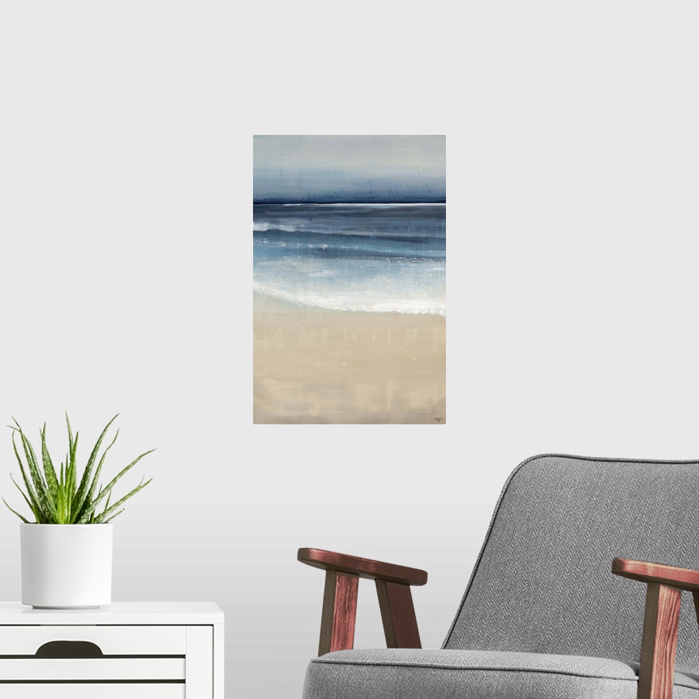 A modern room featuring Contemporary painting of a peaceful beach scene, where the ocean and sand meet.