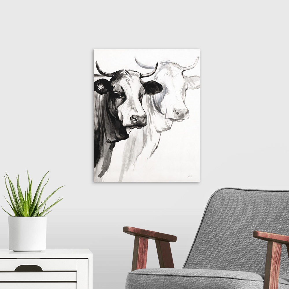 A modern room featuring Black and white panting of two cows with horns on a white background.