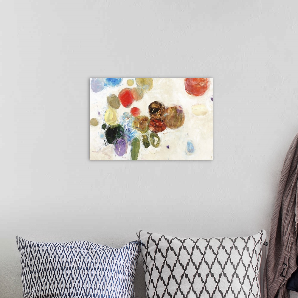 A bohemian room featuring Contemporary abstract painting of several colorful circular shapes against white.