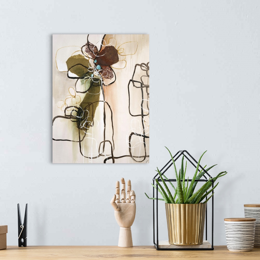 A bohemian room featuring Abstract painting of dark lines creating shapes against an earth toned background.