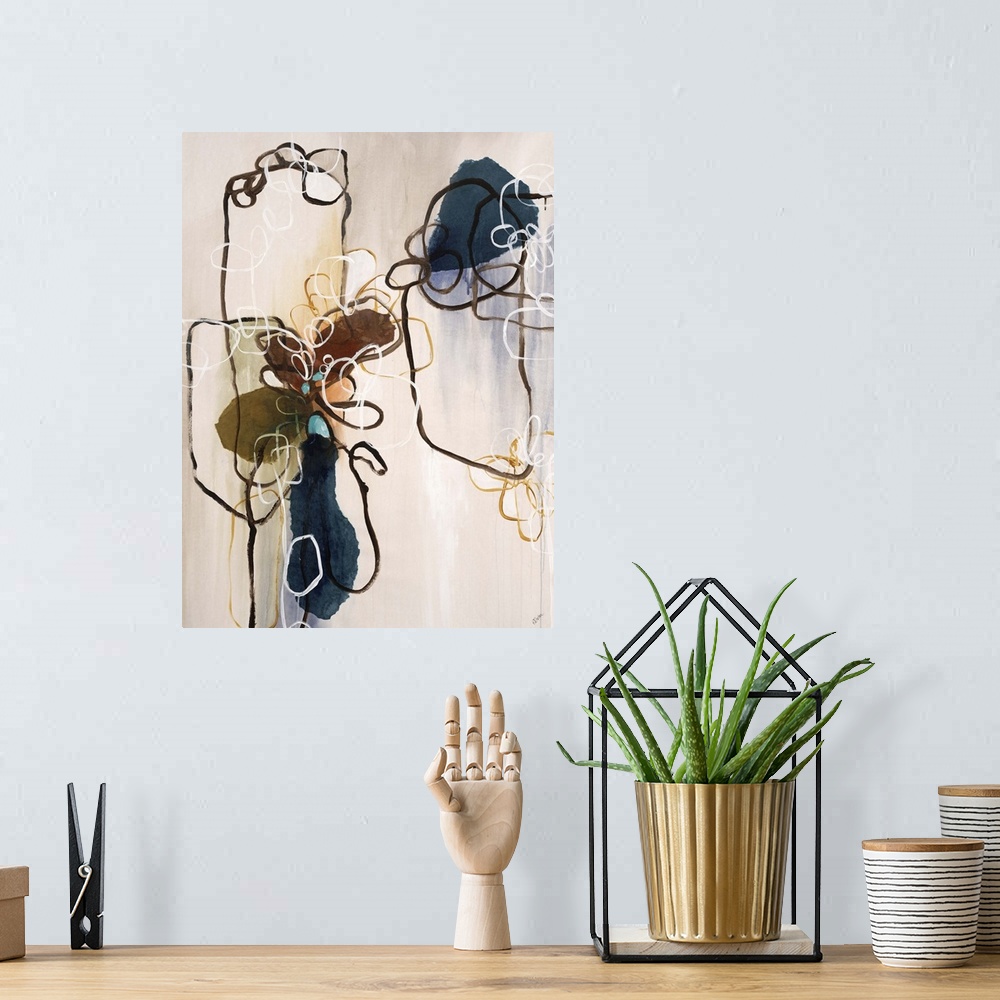 A bohemian room featuring Abstract painting of dark lines creating shapes against an earth toned background.