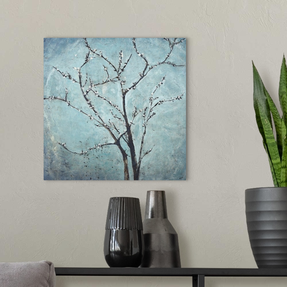 A modern room featuring Contemporary painting of flowering branches against a hazy blue background.