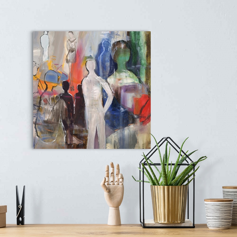 A bohemian room featuring Semi-abstract artwork with several figures in varying size and color.