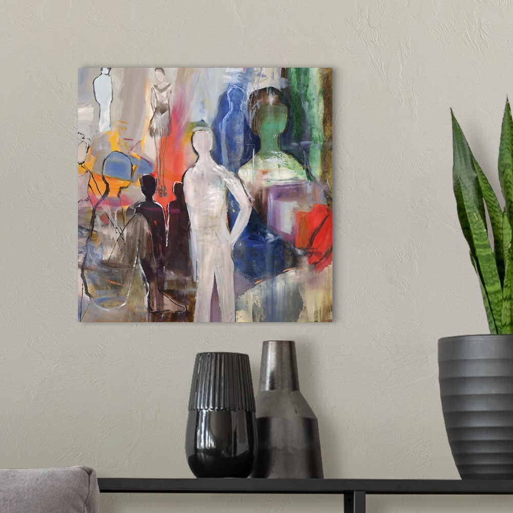 A modern room featuring Semi-abstract artwork with several figures in varying size and color.