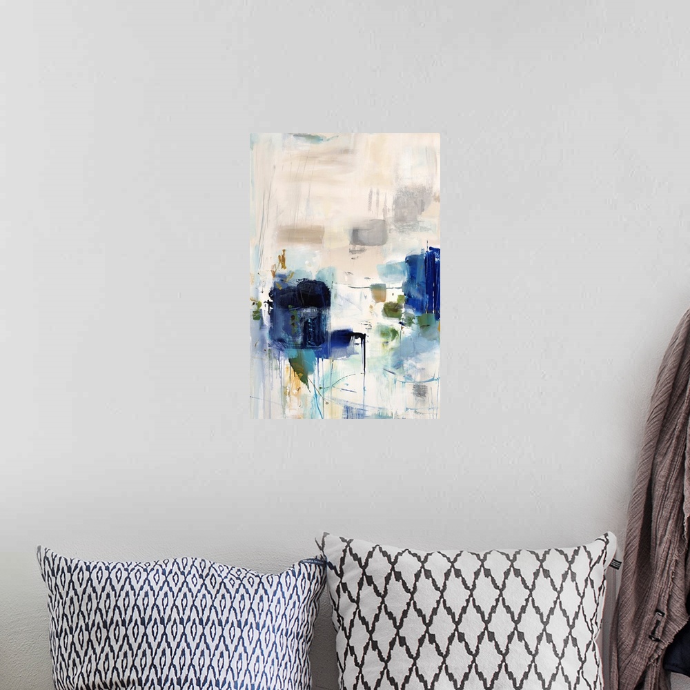 A bohemian room featuring Vertical abstract artwork with vivid squares of blue on white.