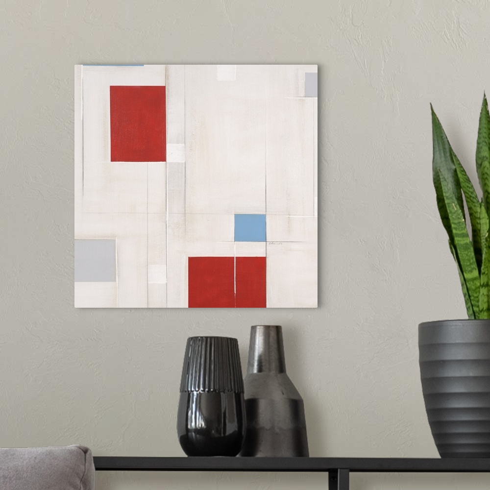 A modern room featuring Contemporary geometric artwork made of square shapes on white.