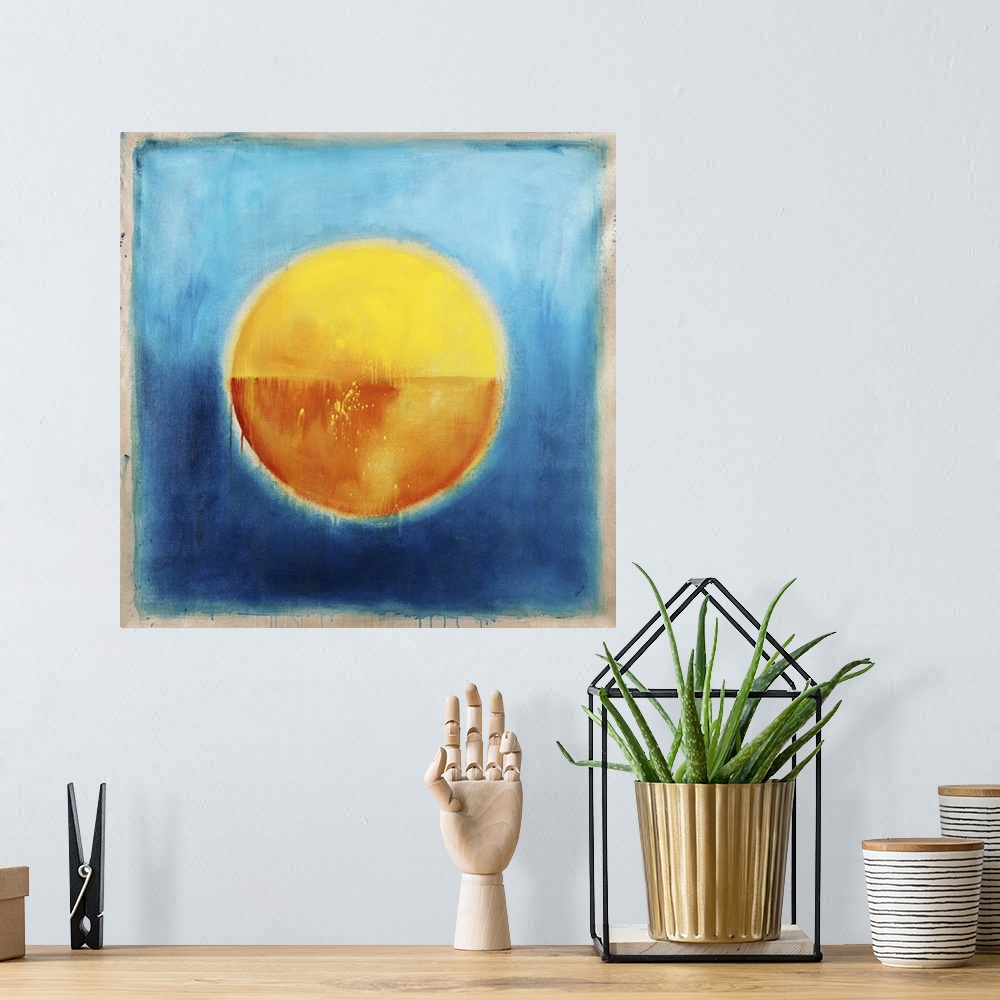 A bohemian room featuring Contemporary abstract painting using vibrant colors t make circle of gold in the center of a blue...