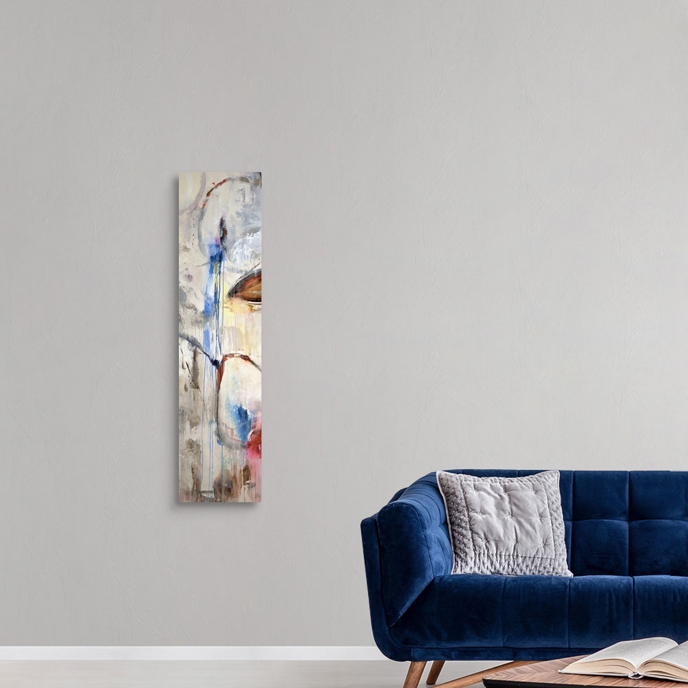 A modern room featuring A tall panoramic piece of abstract artwork that uses a neutral background with pops of color that...