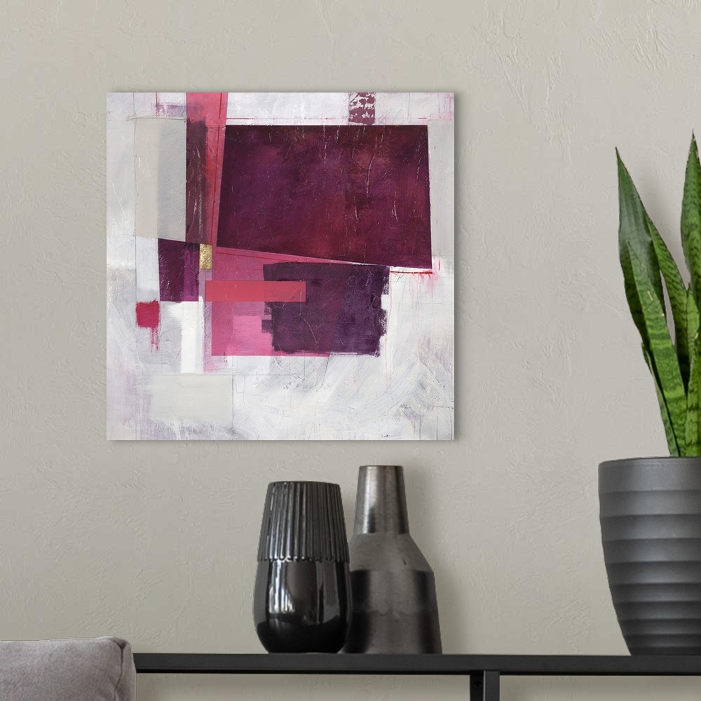 A modern room featuring Square abstract painting with rectangular shapes in shades of pink and purple with a single metal...
