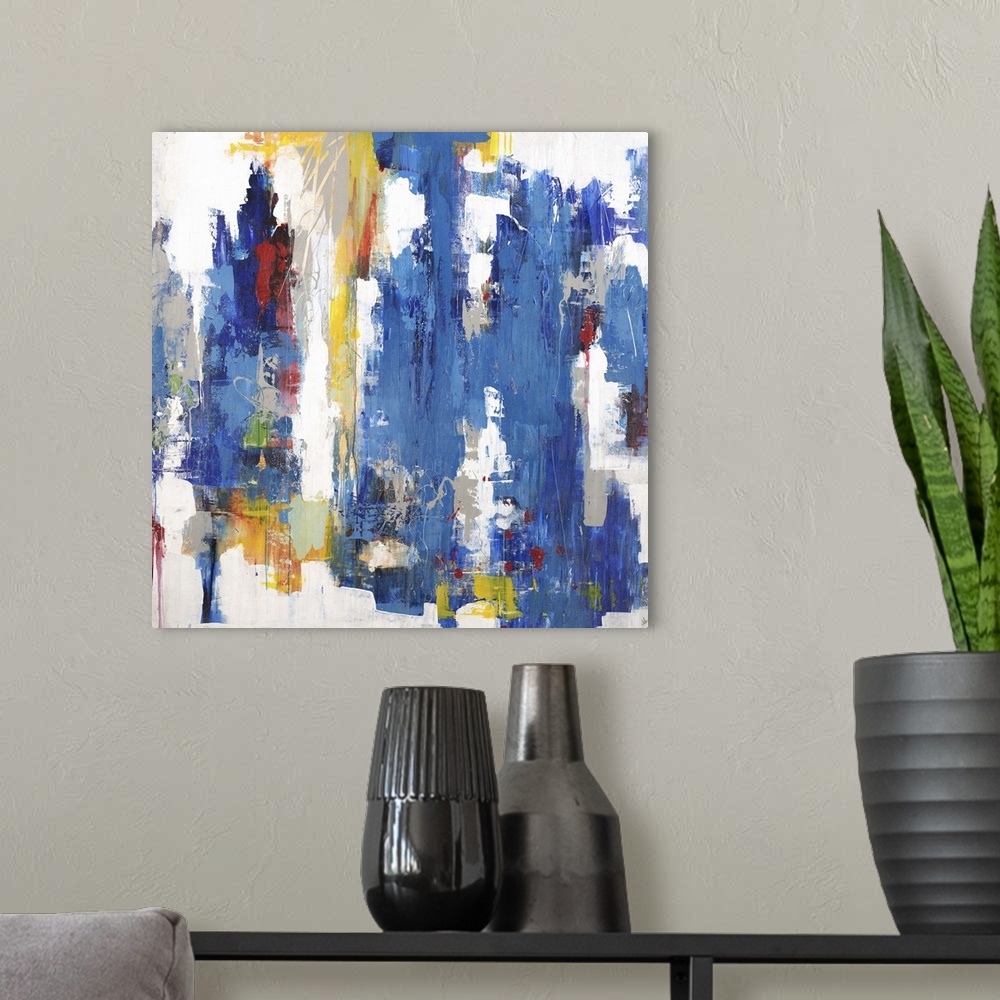 A modern room featuring Contemporary abstract painting using mostly blue in vertical swipes with pops of yellow against a...