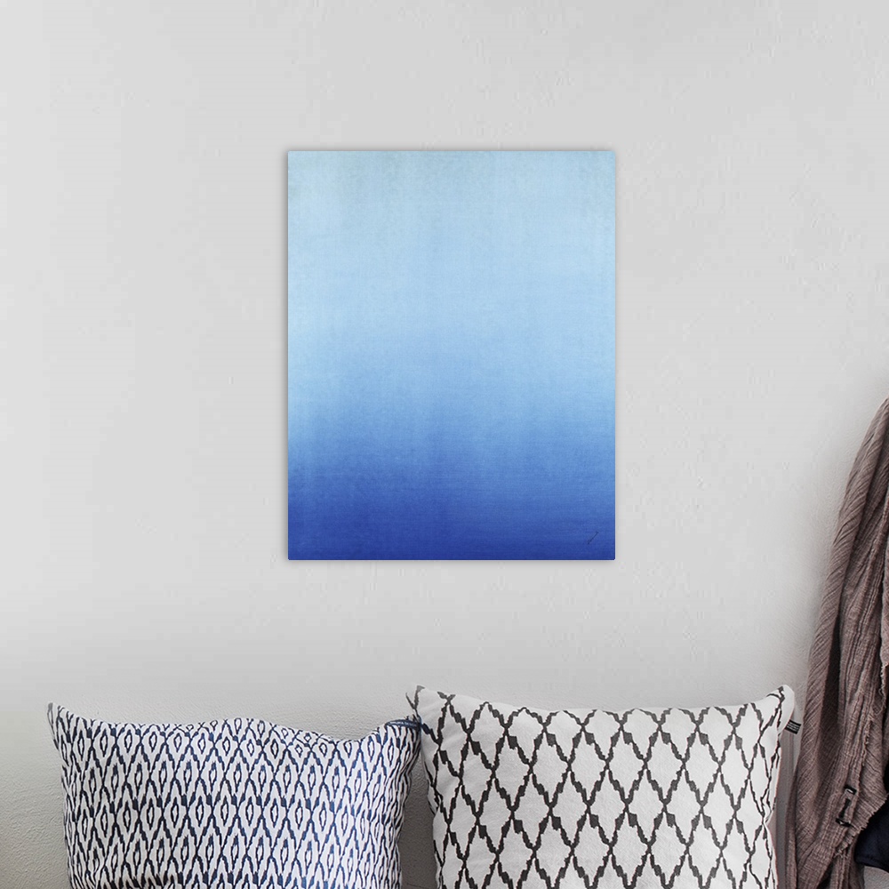 A bohemian room featuring Contemporary painting of blue fading into a lighter blue.