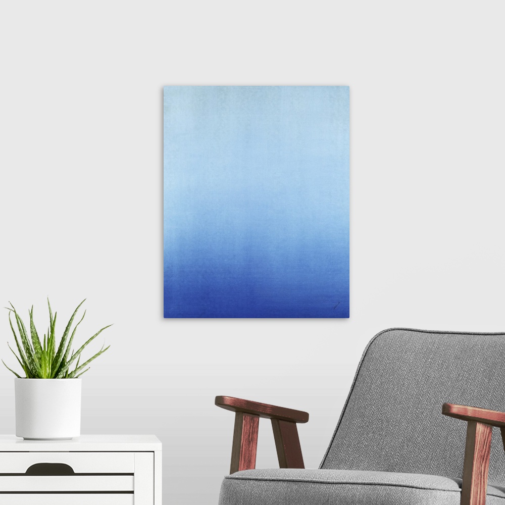 A modern room featuring Contemporary painting of blue fading into a lighter blue.