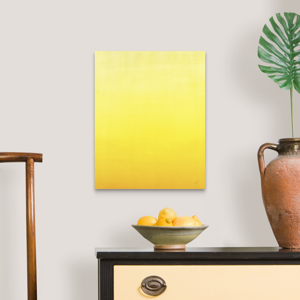 A traditional room featuring Contemporary painting of yellow fading into a lighter shade.