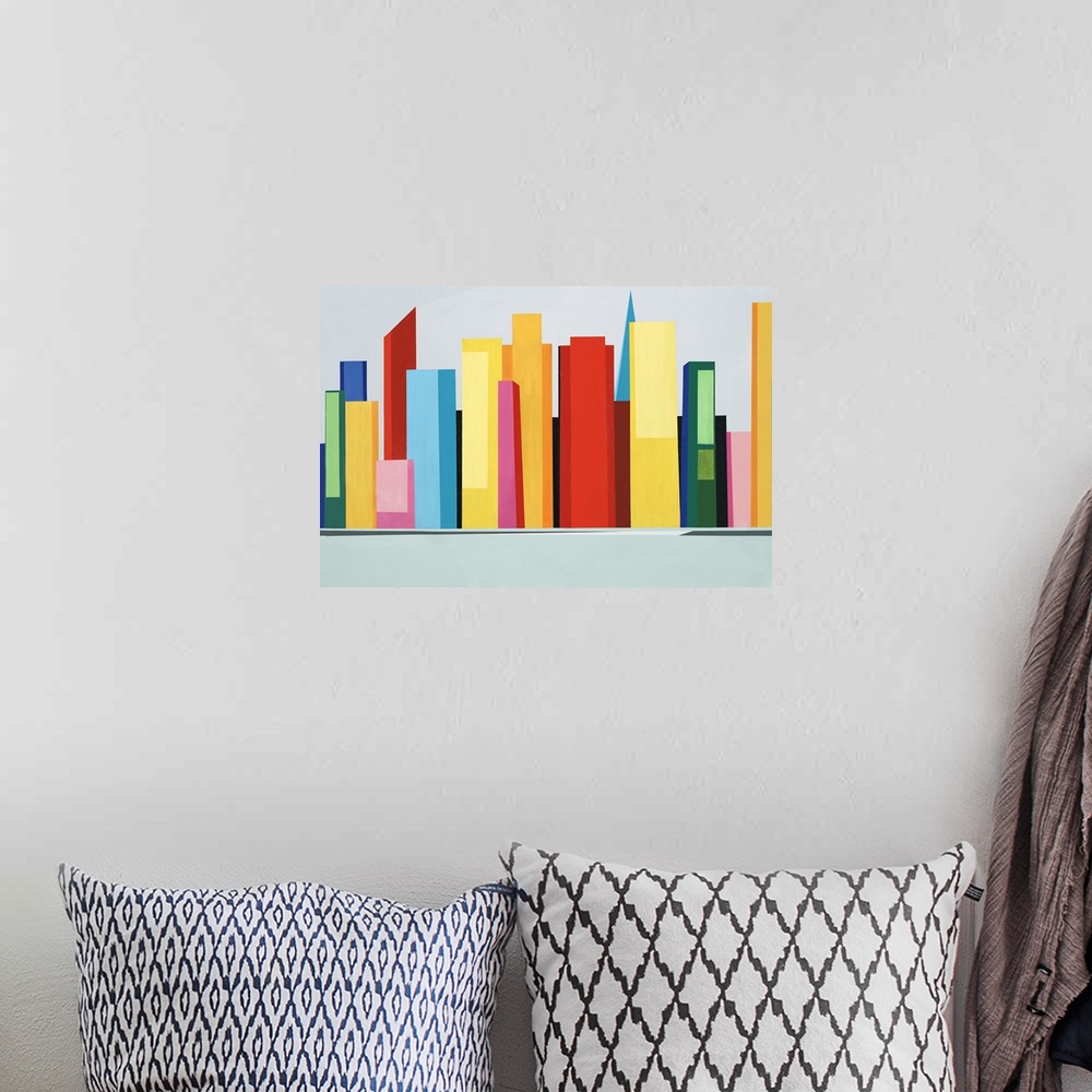 A bohemian room featuring Large abstract artwork of a colorful city skyline created with large geometric shapes.