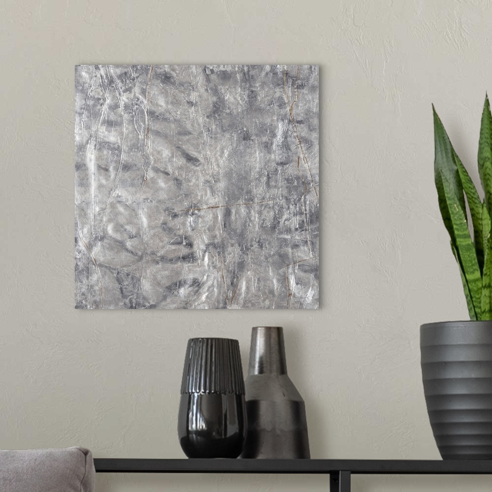 A modern room featuring A textured abstract painting in shades of silver with faint brown lines throughout.