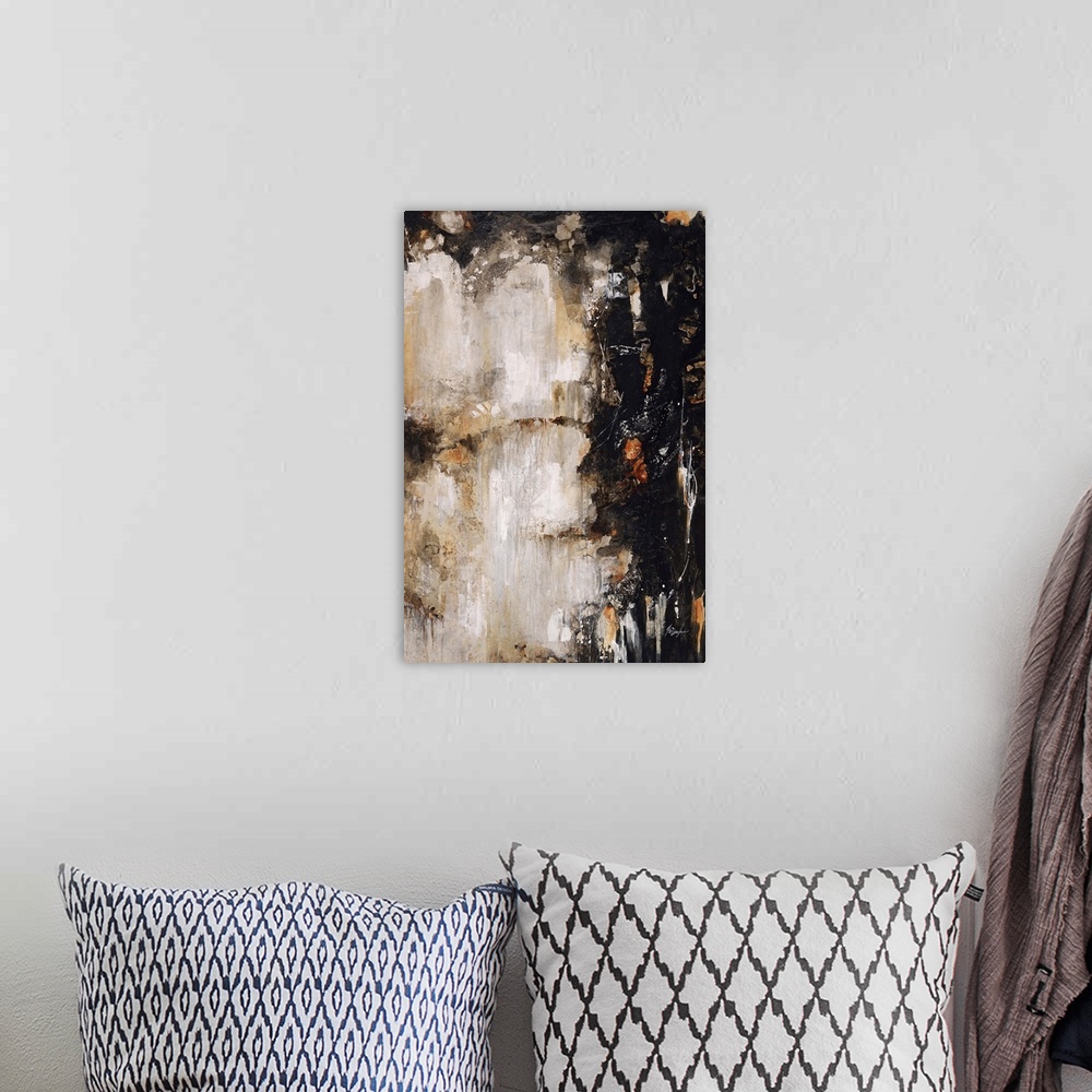 A bohemian room featuring Abstract painting of deep black and rich earth tones clashing toward the center of the image.