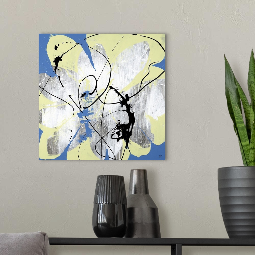 A modern room featuring A lively abstract painting of a flower in shades of yellow and blue.