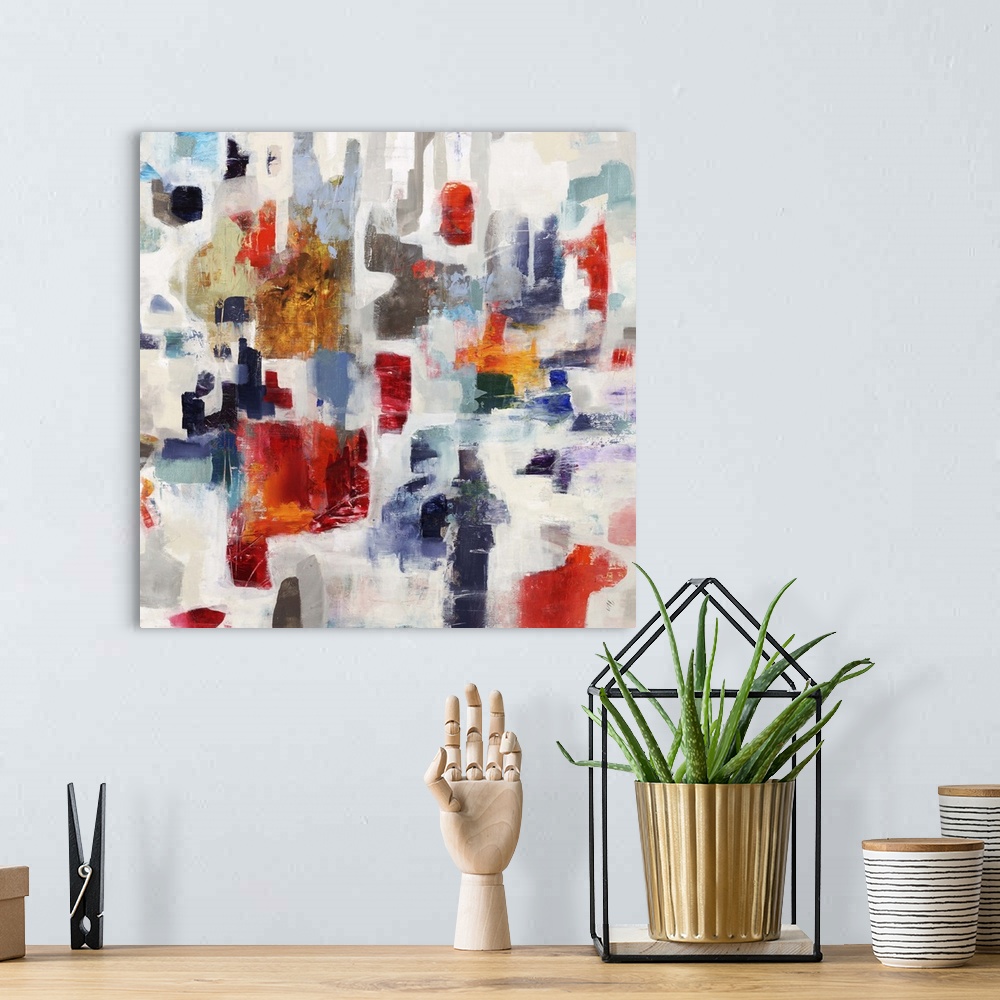 A bohemian room featuring Contemporary abstract painting with bright blocks of red and blue color against a pale background.
